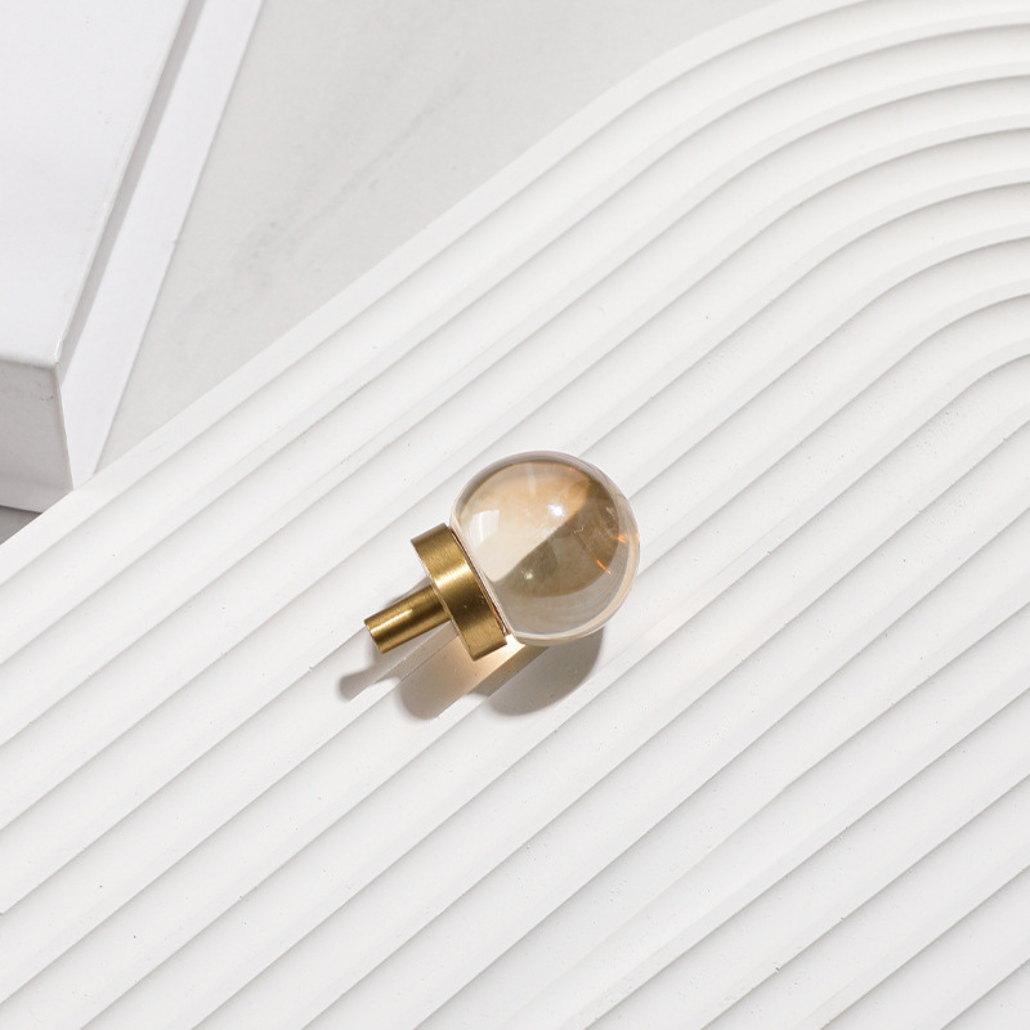 Brass essence natural crystal ball and brass cabinet knob, showcasing a polished spherical crystal and elegant metallic finish.