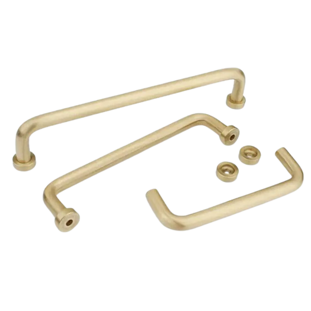 Minimalist solid brass curved handle by Brass Essence, showcasing smooth, polished brass surface and sleek curved design.