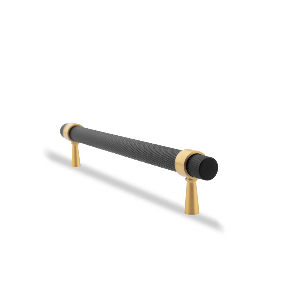 Black and gold knurled T-bar handle by Brass Essence, showcasing textured grip and polished finish for furniture or cabinetry.