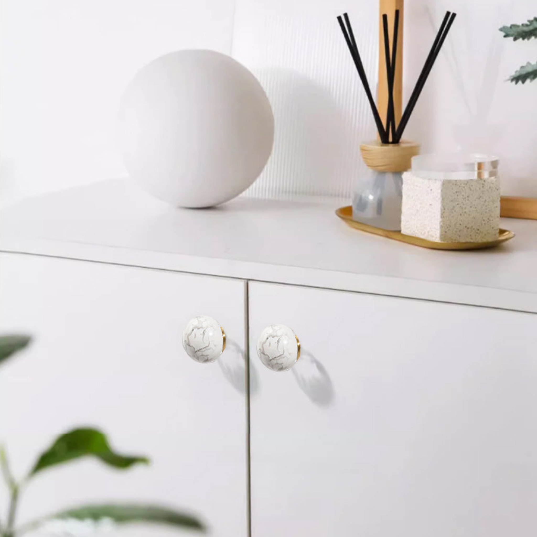 Natural crystal ball and brass cabinet knob from Brass Essence, showcasing a polished crystal sphere atop a brass fixture.