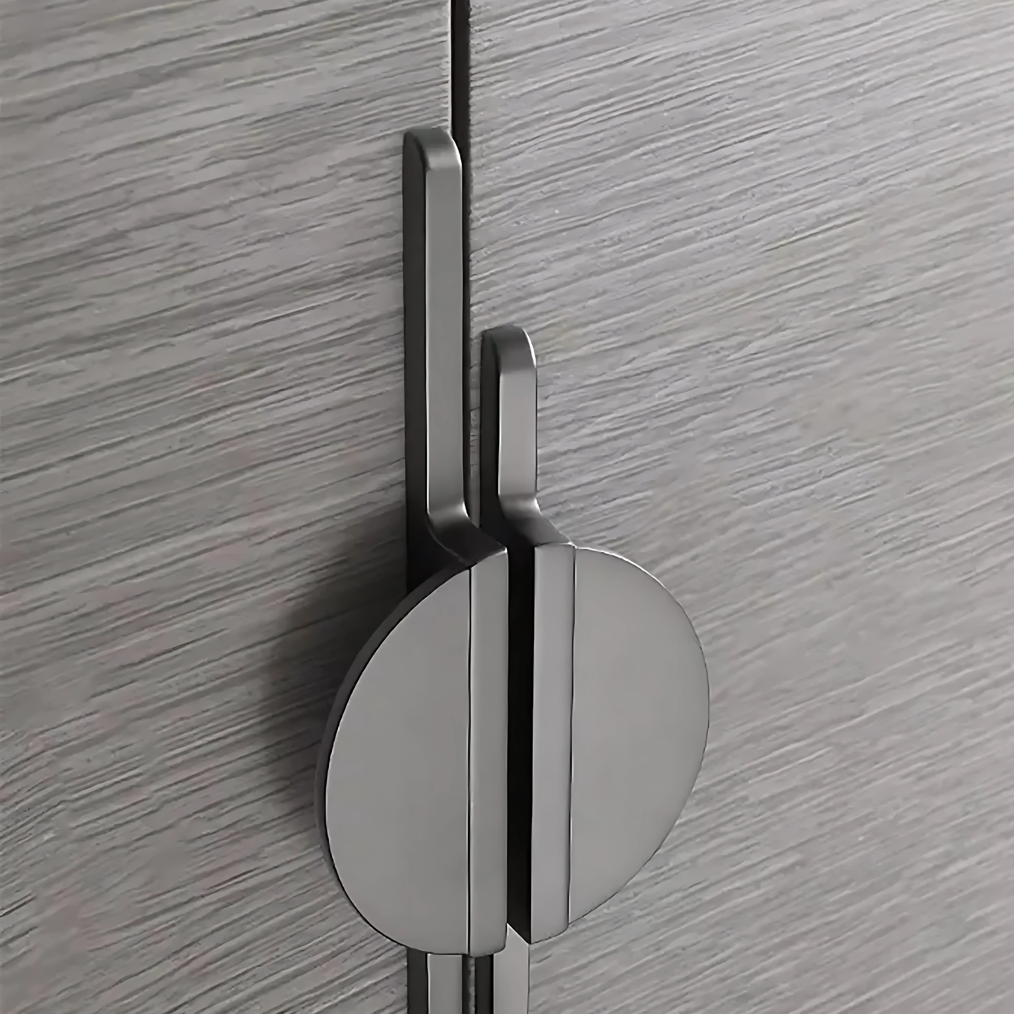 Brass Essence Hemi Cycle Zinc Half-Circle Pull handle with a sleek, half-moon design for furniture or cabinetry.