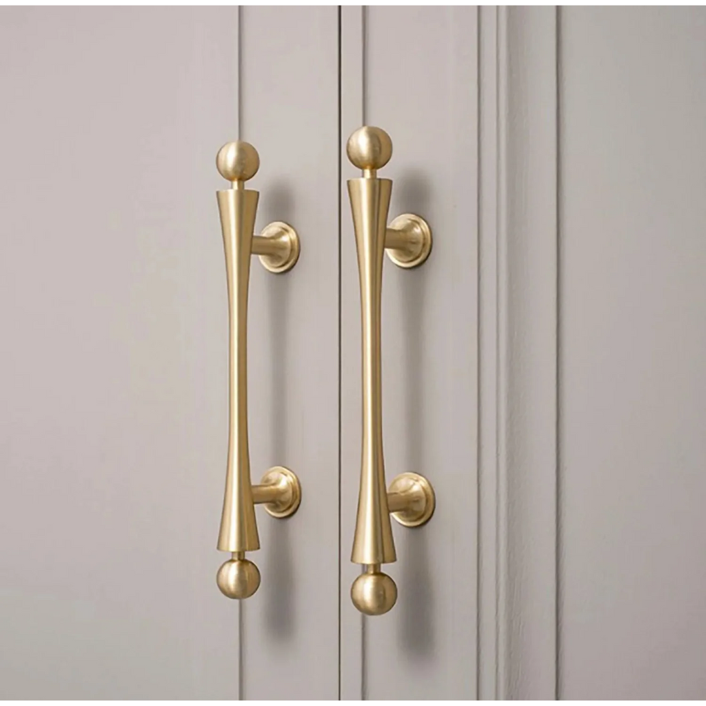 Brass Essence Seasaw Hourglass brushed brass cabinet handle with sleek, modern design and ergonomic shape for furniture drawers.