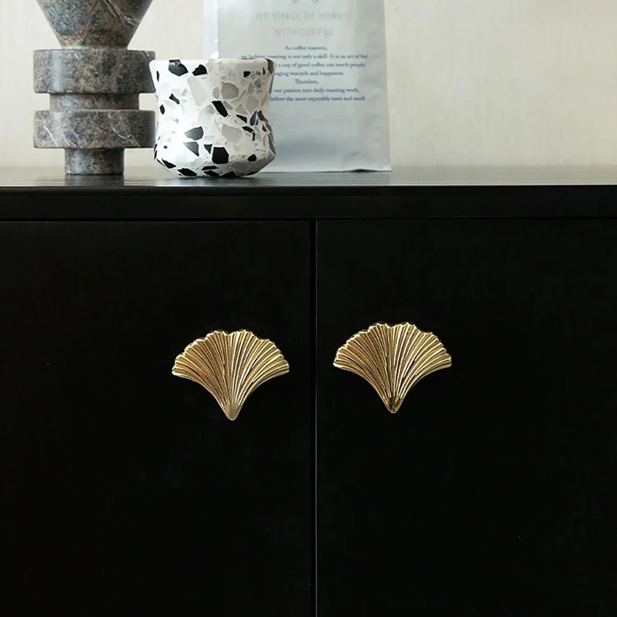 Polished gold Ginkgo leaf cabinet pull by Brass Essence, featuring detailed leaf design and smooth finish for furniture accents.