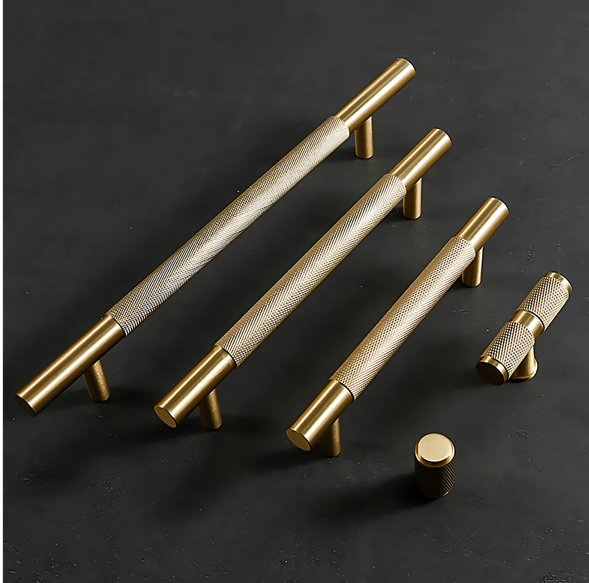 Brass essence Yashvite knurled brass cabinet handle from the B-0060 collection, featuring a textured, polished surface with mounting hardware.