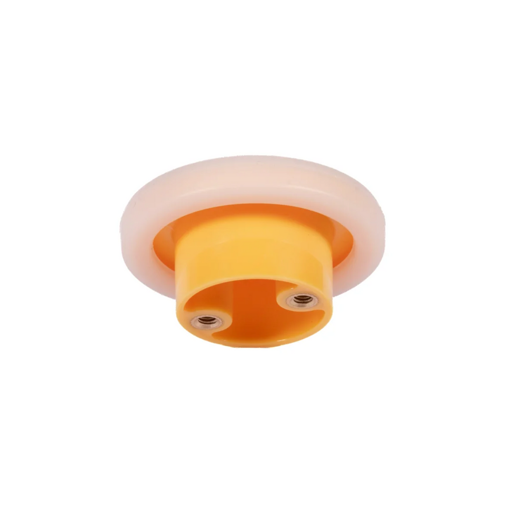 Brass Essence soft-touch silicone and ABS cabinet knob mounted on a door, showcasing smooth, modern hardware design.