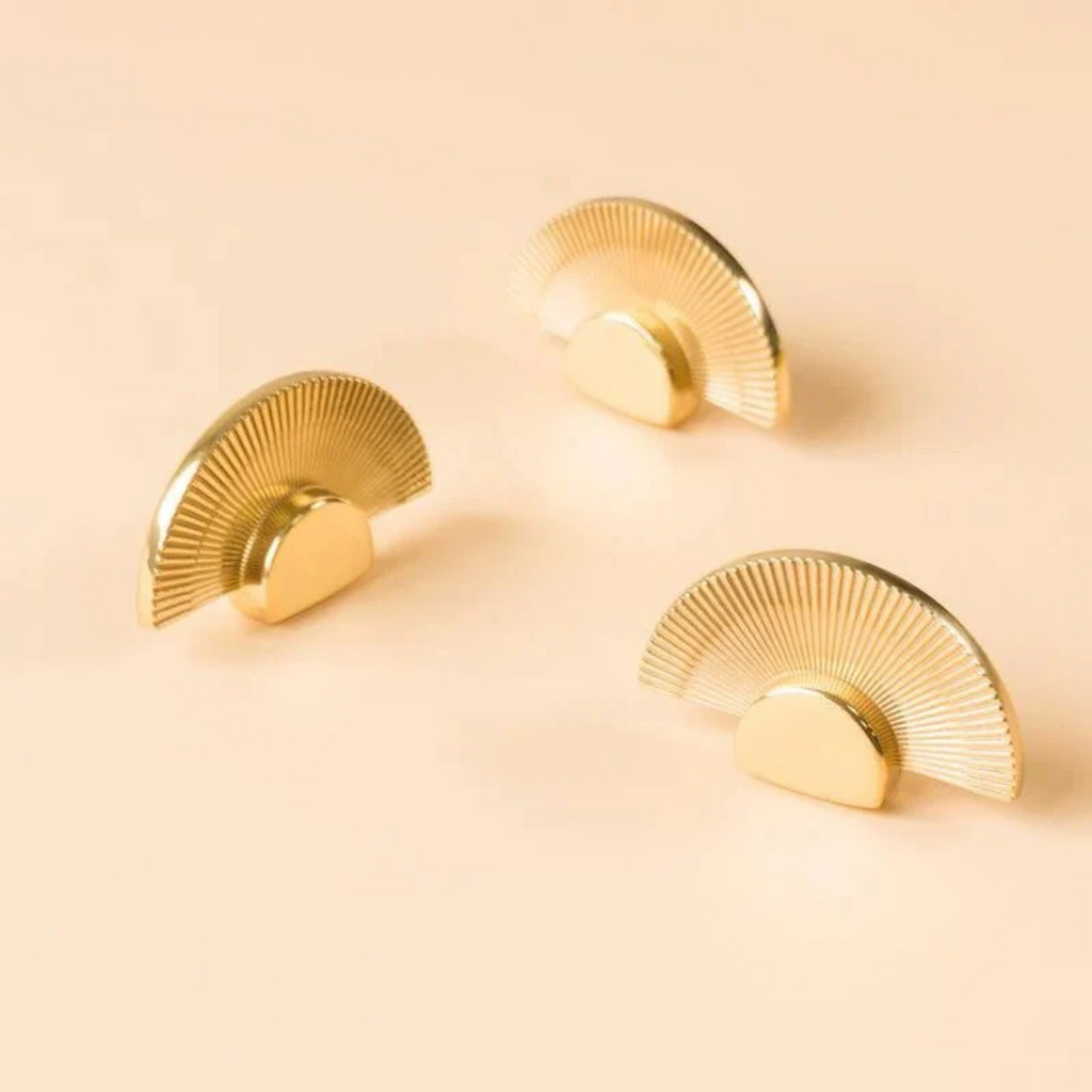 Brass Essence scalloped brass fan handle from the Collection B-0085, featuring intricate scalloped edges and a polished brass finish.