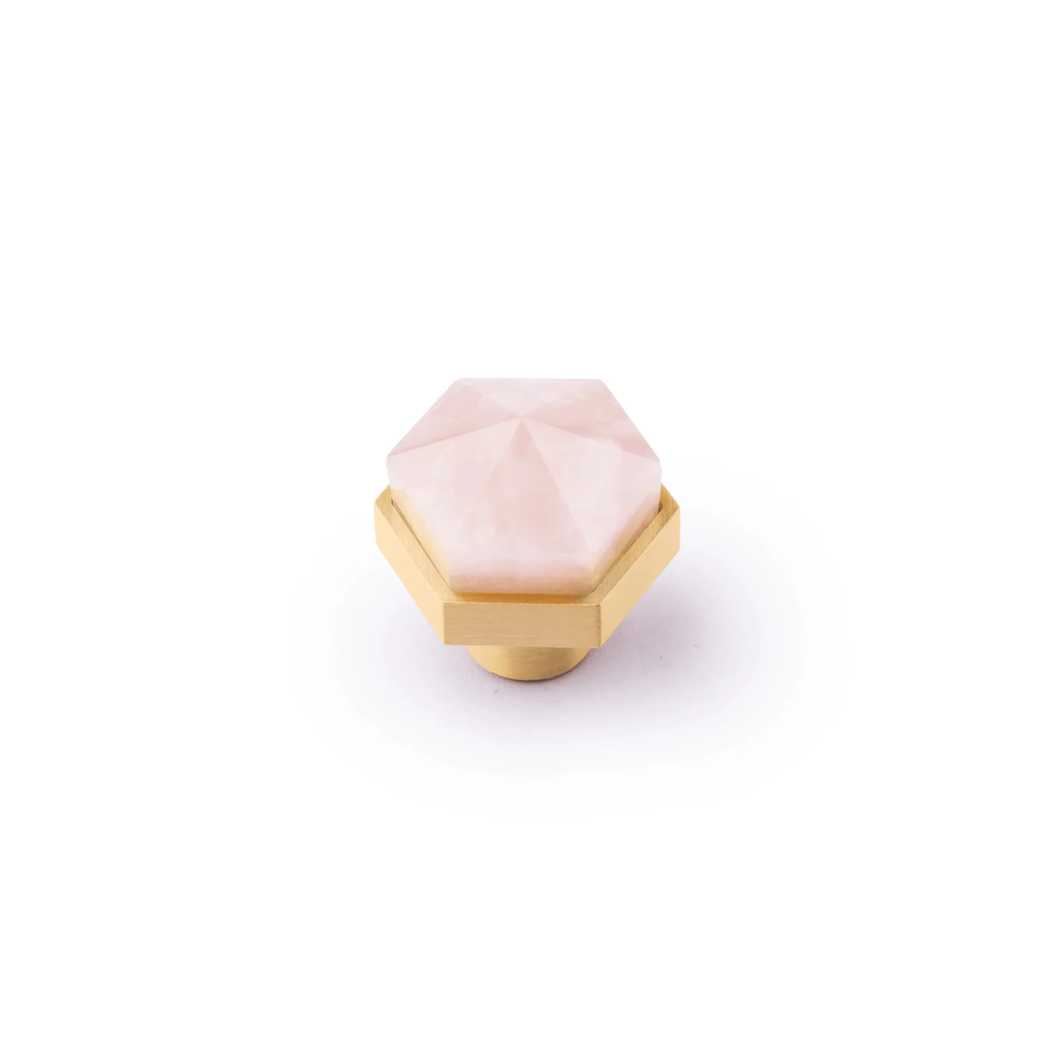 Natural crystal and brass hexagon knob from Brass Essence, showcasing a polished crystal sphere with brass hexagon base.