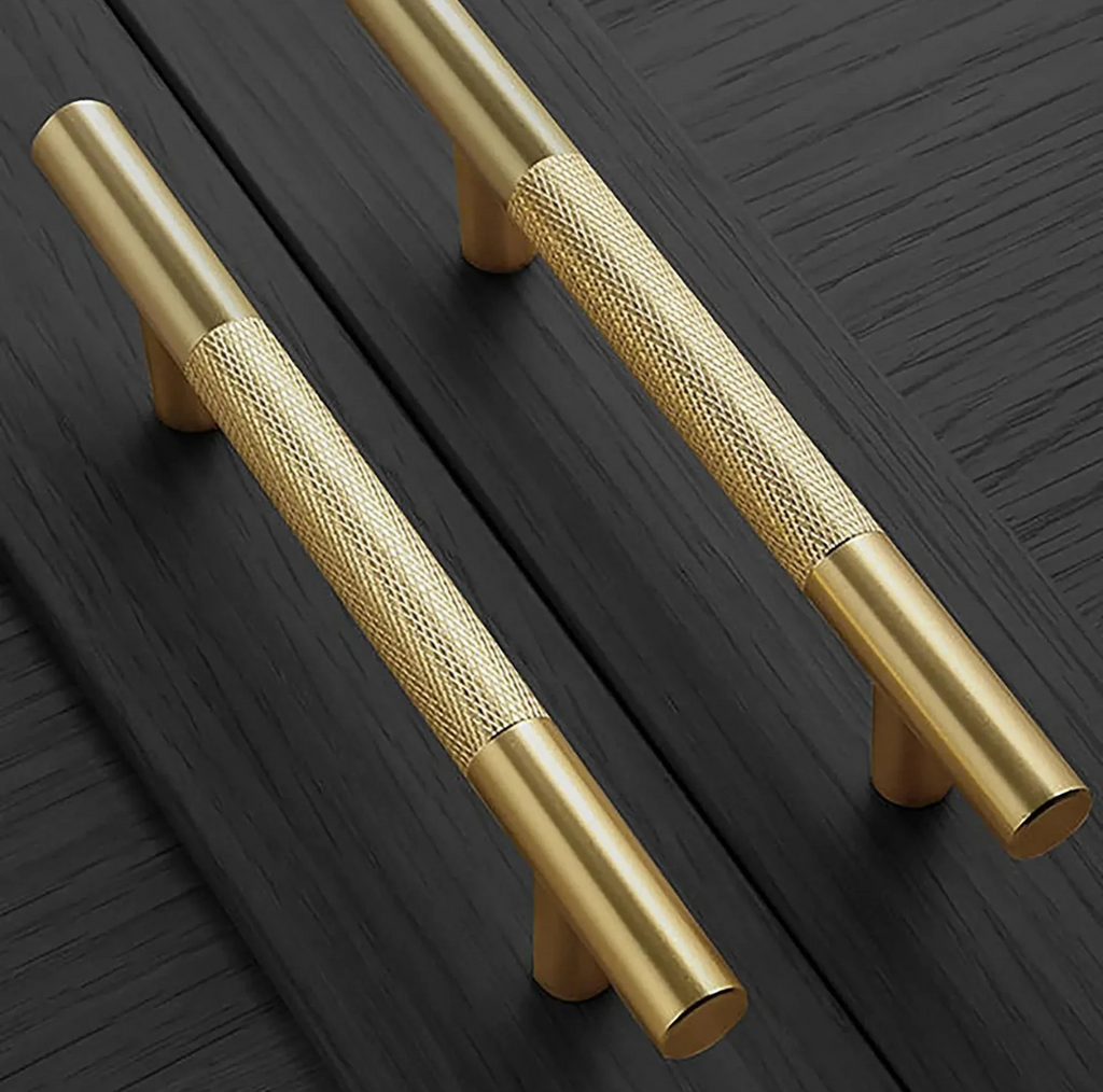 Brass essence Yashvite knurled brass cabinet handle from the B-0060 collection, showcasing a textured, polished finish and ergonomic design.