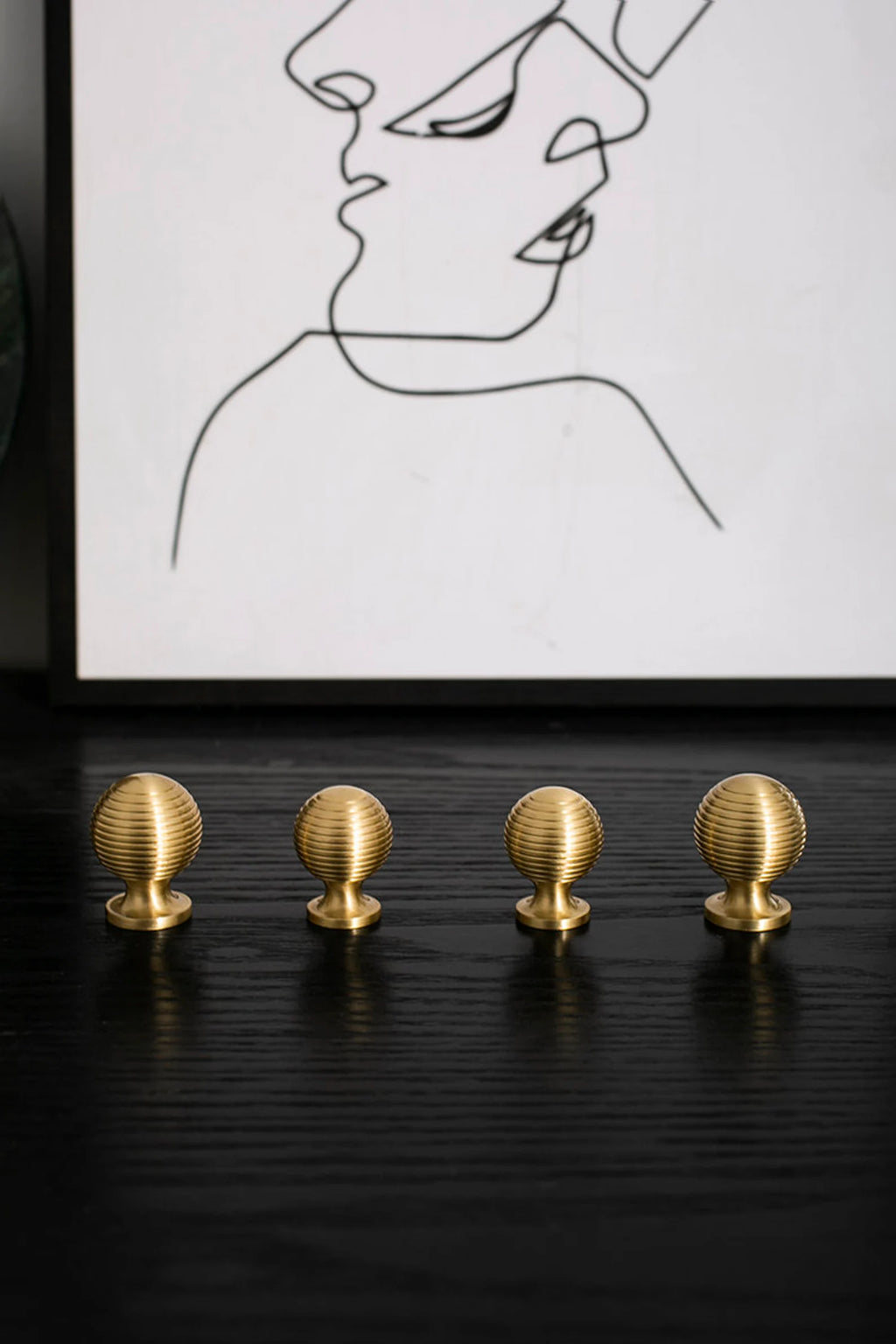 Brass Essence Alexander & Wicks brass knob with a brushed finish, showcasing a luxurious and modern hardware design.